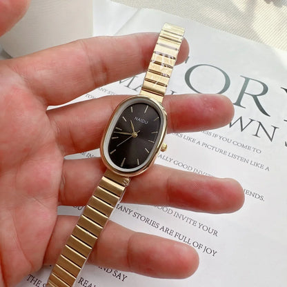 Reloj de pulsera moderno para mujer, diseño ovalado de cuarzo con correa metálica de bambú